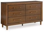 Dark brown wooden dresser with six drawers and brass bar pulls, tapered legs