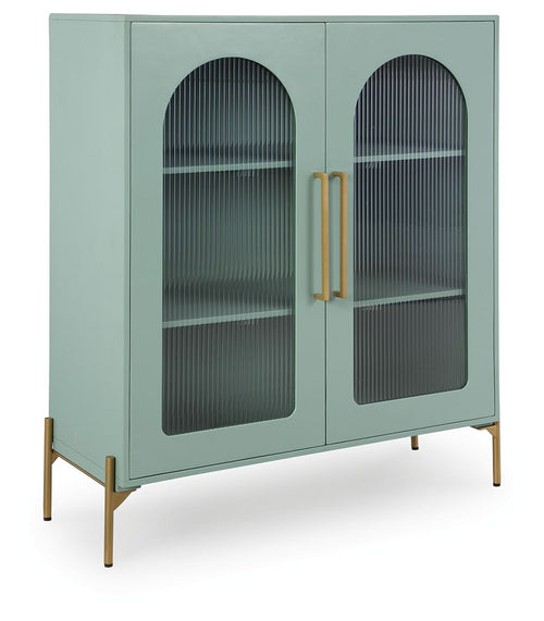 Light green accent cabinet with arched glass doors and gold pull handles
