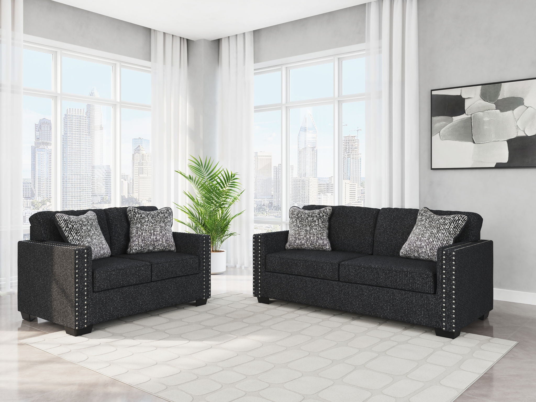 Black textured seating set with matching loveseats and accent pillows