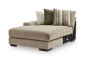 Corner chaise lounge with beige fabric upholstery and two accent pillows, including striped cushion