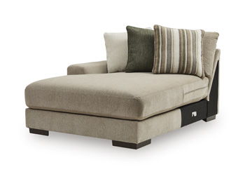 Corner chaise lounge with beige fabric upholstery and two accent pillows, including striped cushion