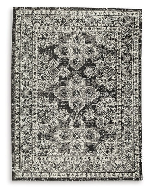 Glennisman rug, rectangular vintage medallion pattern in gray with dark accents, border