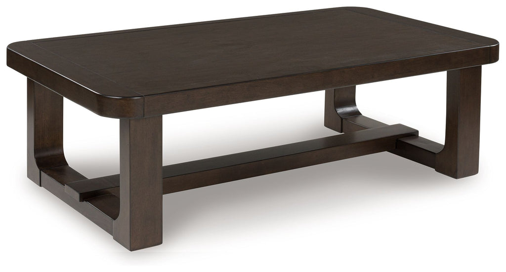 Dark brown rectangular cocktail table side view with open lower shelf