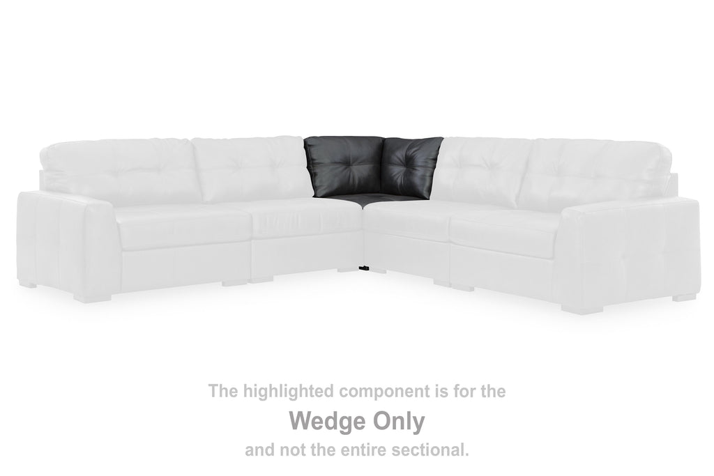 White sectional sofa corner with highlighted dark wedge insert