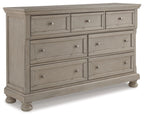 Gray dresser with six drawers, metal knobs, and short turned legs
