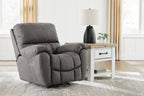 Gray fabric power rocker recliner with cushioned back, padded arms, adjustable headrest