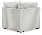 Light gray ribbed upholstered sectional wedge corner piece with vertical channeling