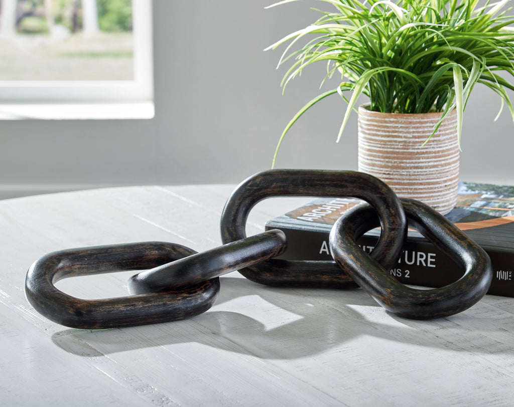 Black chain sculpture with interlocking oval links and dark sheen