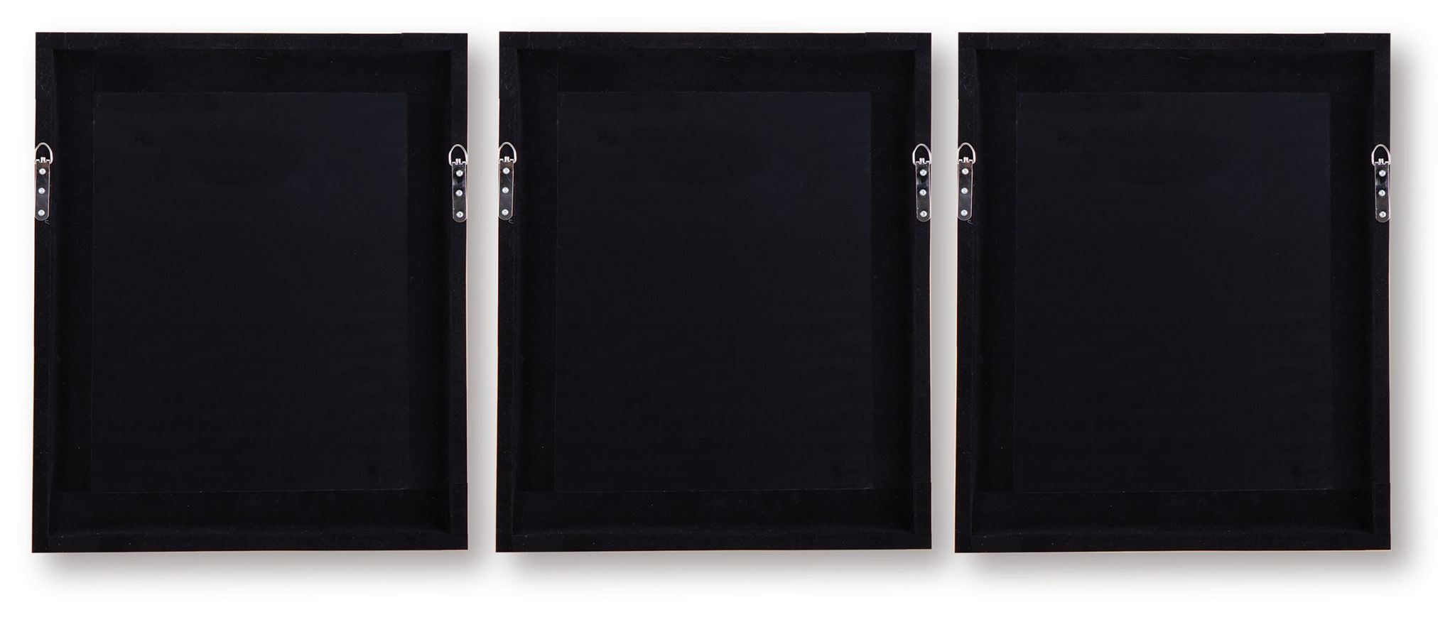 Set of 3 wall art frames showing dark backs with hanging hardware