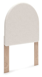 Upholstered panel headboard with arched white fabric and wooden legs