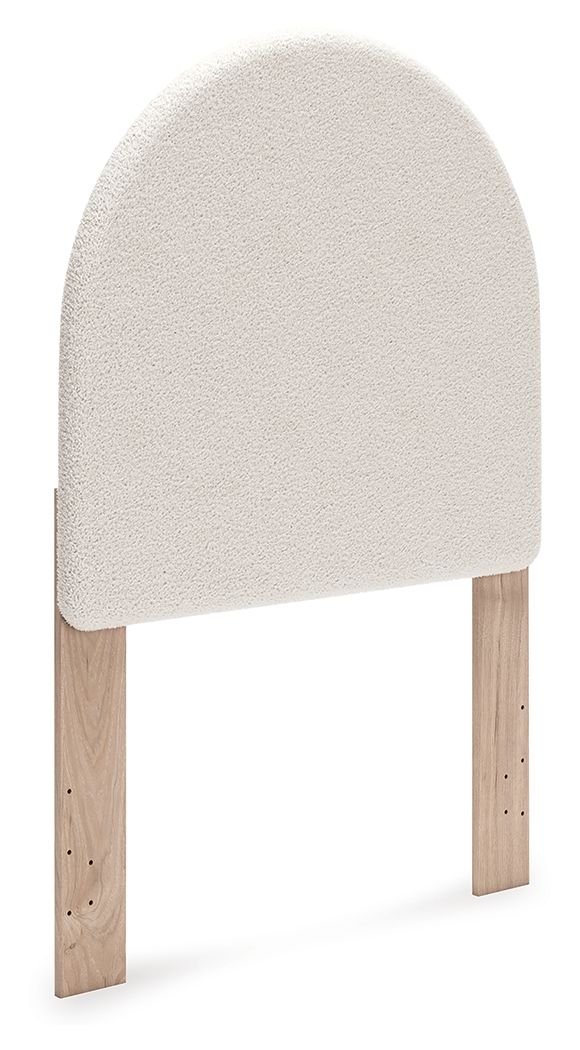 Upholstered panel headboard with arched white fabric and wooden legs