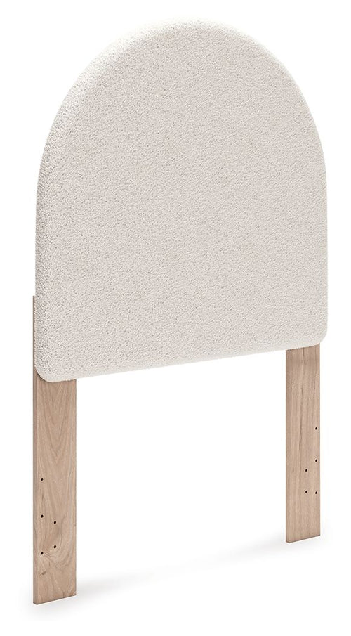 Upholstered panel headboard with arched white fabric and wooden legs