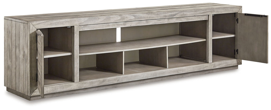 Gray TV stand angled view with a side cabinet door and open storage compartments