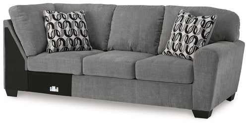 Gray fabric 3-seat sofa with corner wedge, square arms, and patterned throw pillows