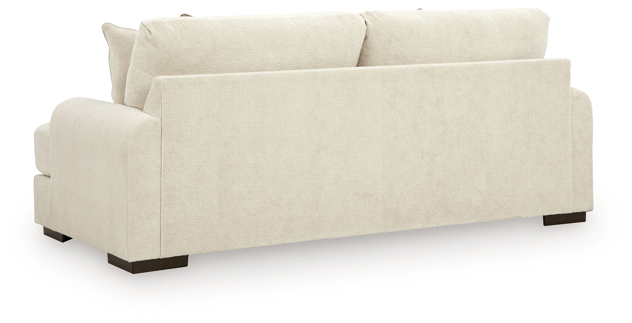 Light beige fabric sofa with wide arms and three seat cushions