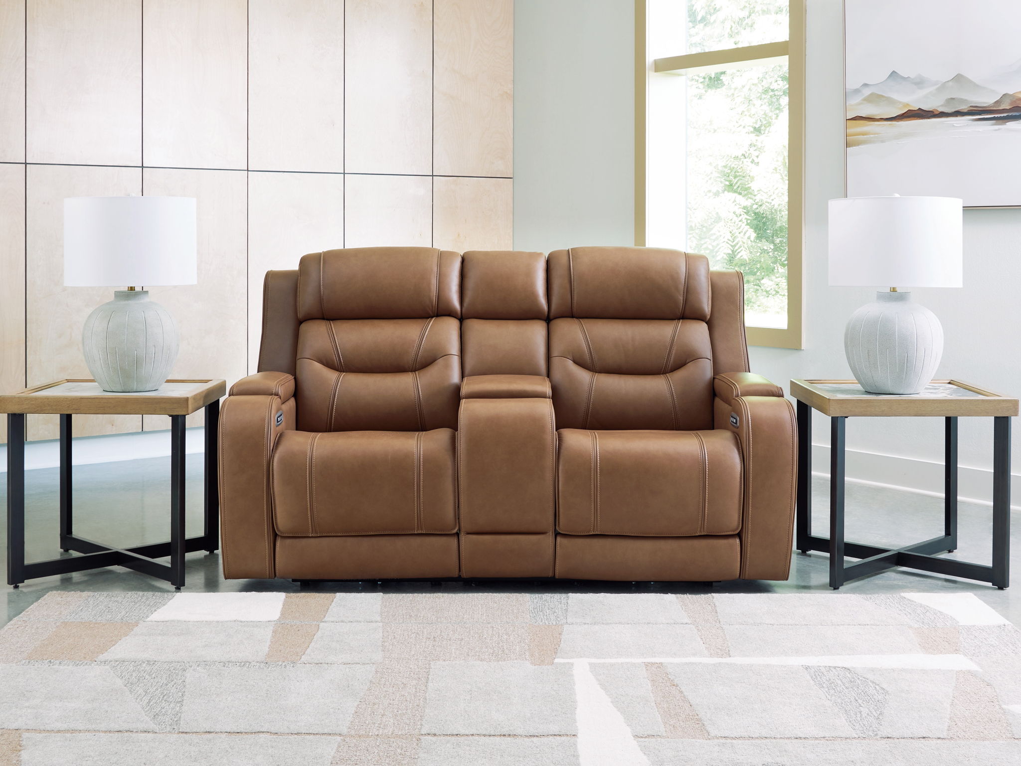 Power reclining loveseat with audio seating in brown, shown front view with footrests