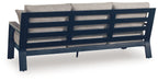 Outdoor sofa back view with dark blue frame and light gray cushion panels