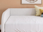 Beige upholstered day bed backrest with white mattress and side pillows