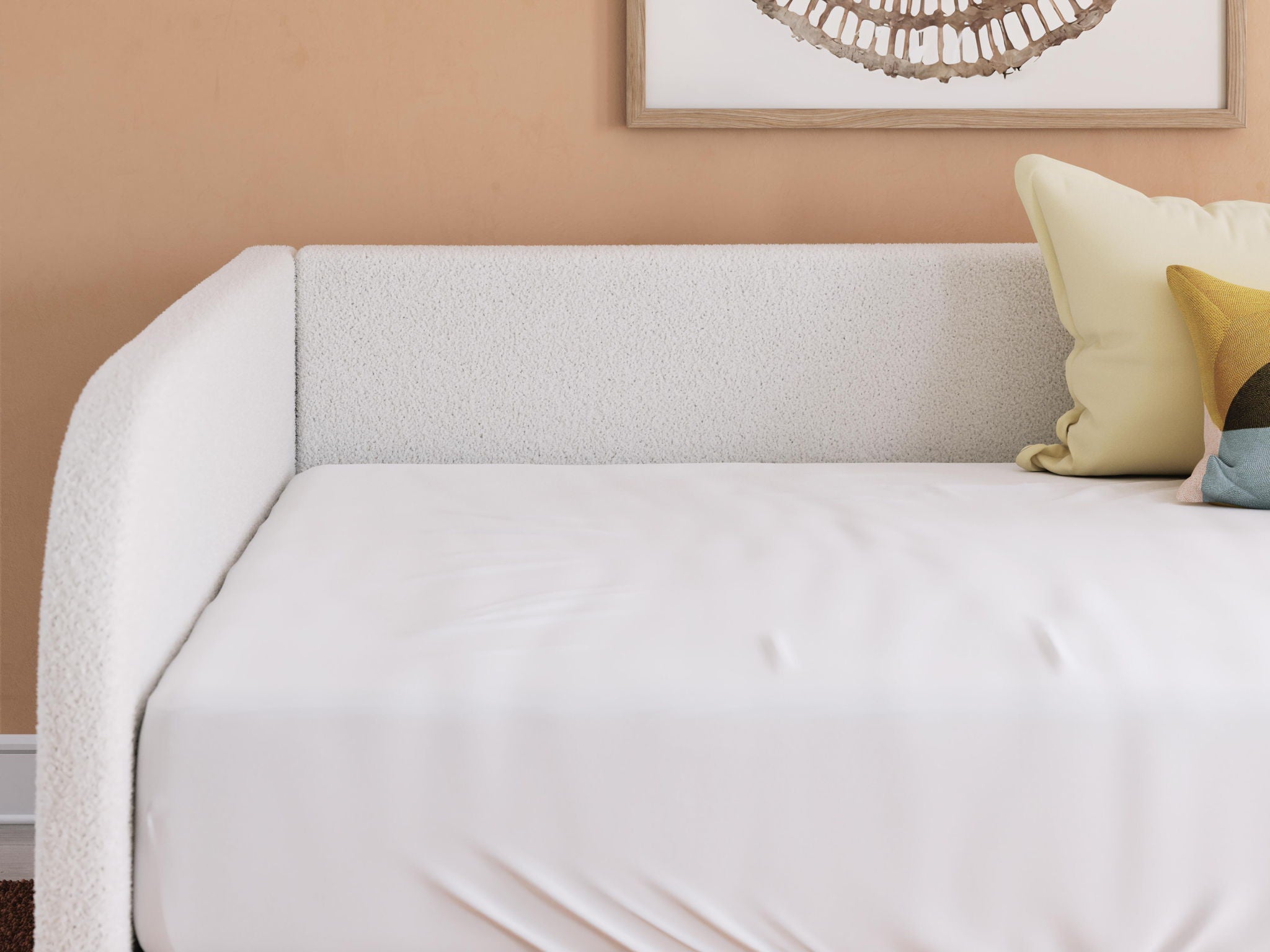 Beige upholstered day bed backrest with white mattress and side pillows