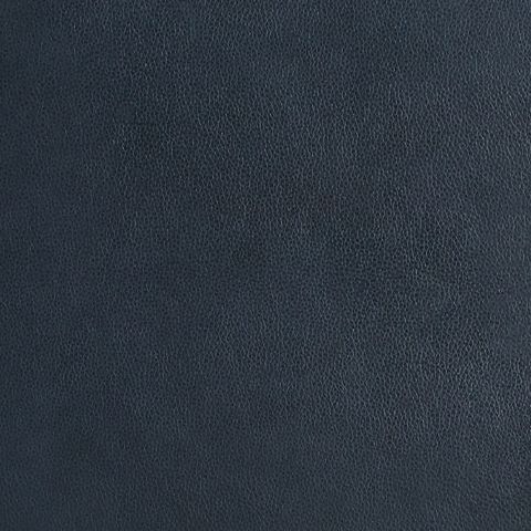 Close-up of dark navy blue leather upholstery grain