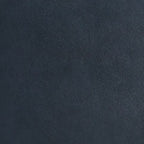 Close-up of dark navy blue leather upholstery grain