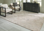 Beige geometric rug with lattice chevron pattern and textured border