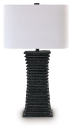 Black poly table lamp with ribbed column base and white fabric shade