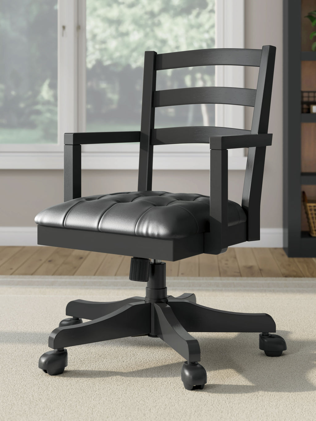 Swivel desk chair in black with dark padded seat and ladder back, casters on base