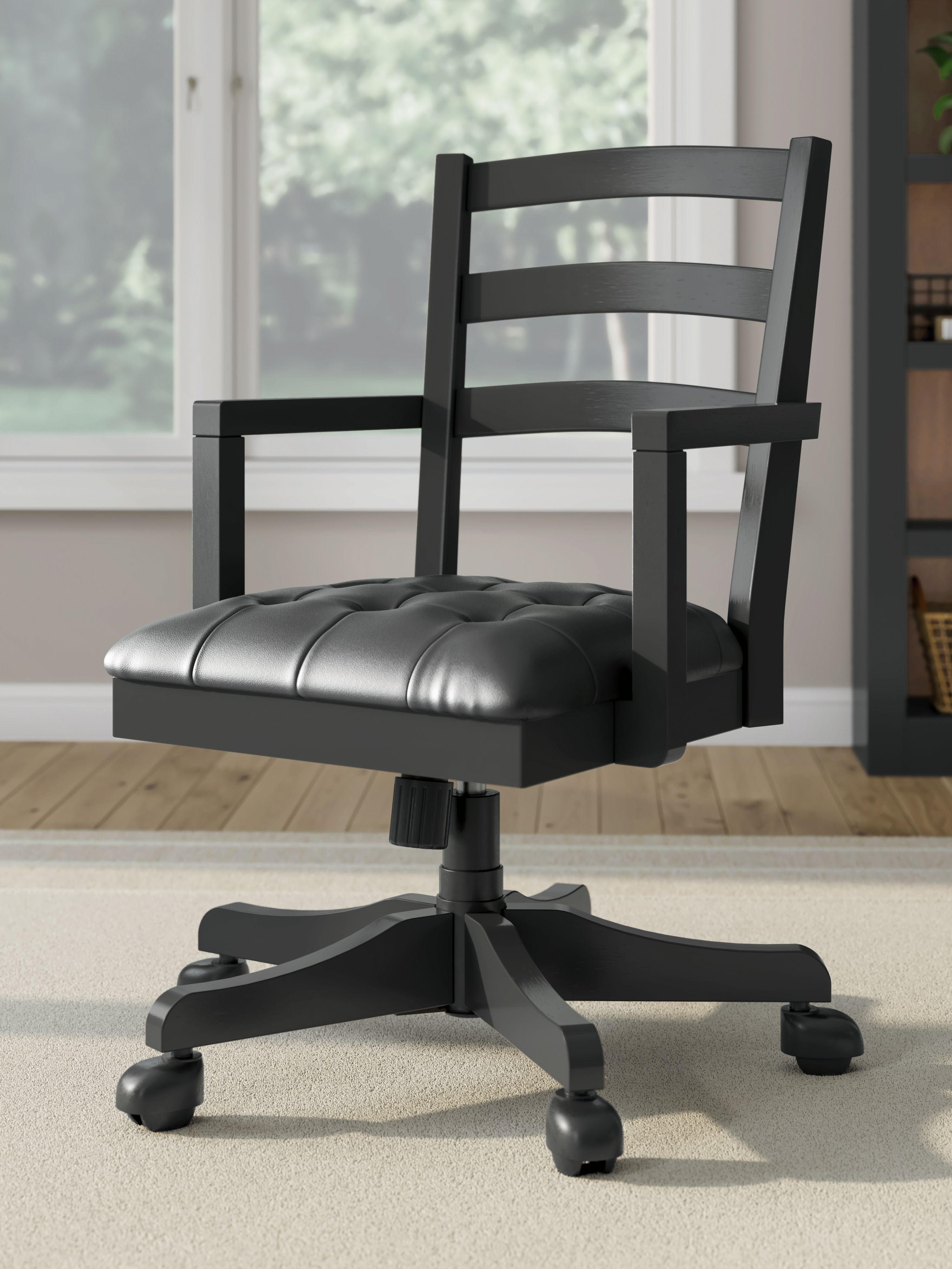 Swivel desk chair in black with dark padded seat and ladder back, casters on base