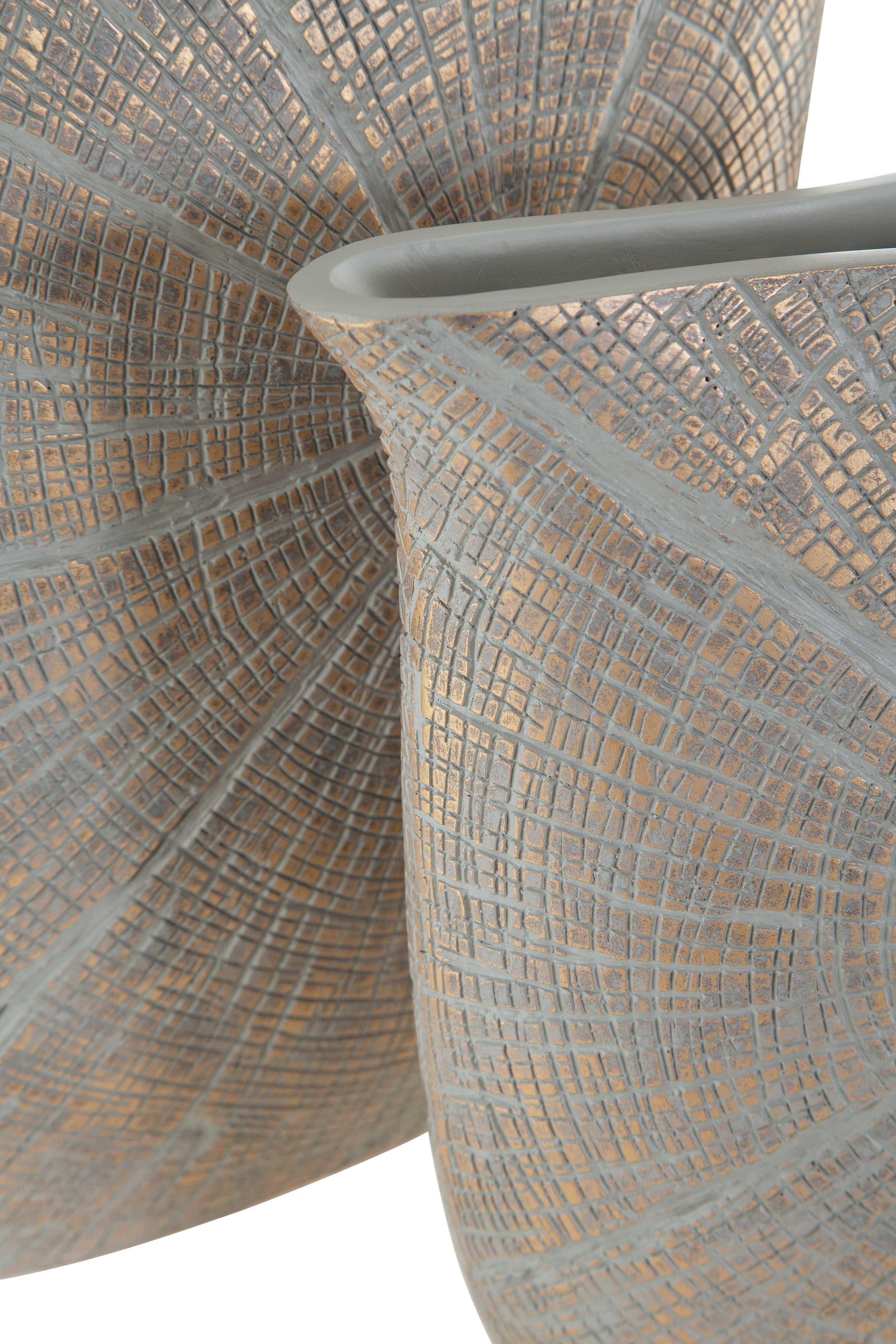 Two blue-gray vases with radial mosaic pattern, angled side-by-side view