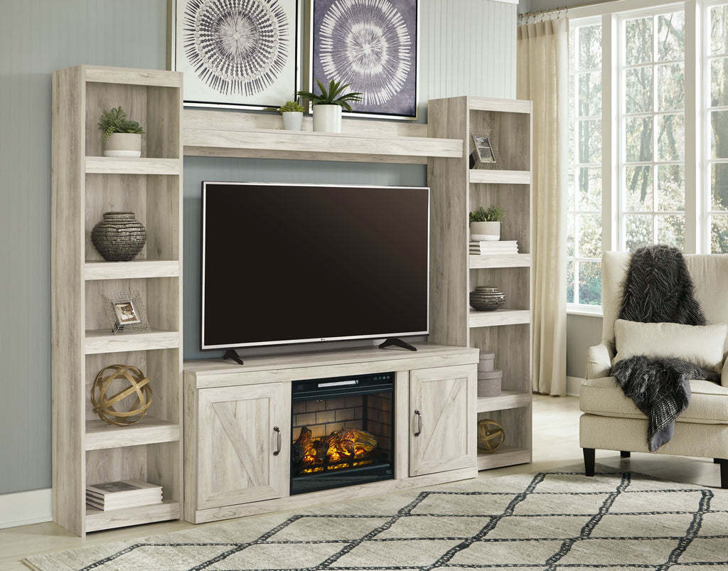Beige entertainment center with open shelves, TV cabinet, and glowing electric fireplace