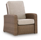 Beige upholstered recliner chair with woven wicker sides, arms, and back support