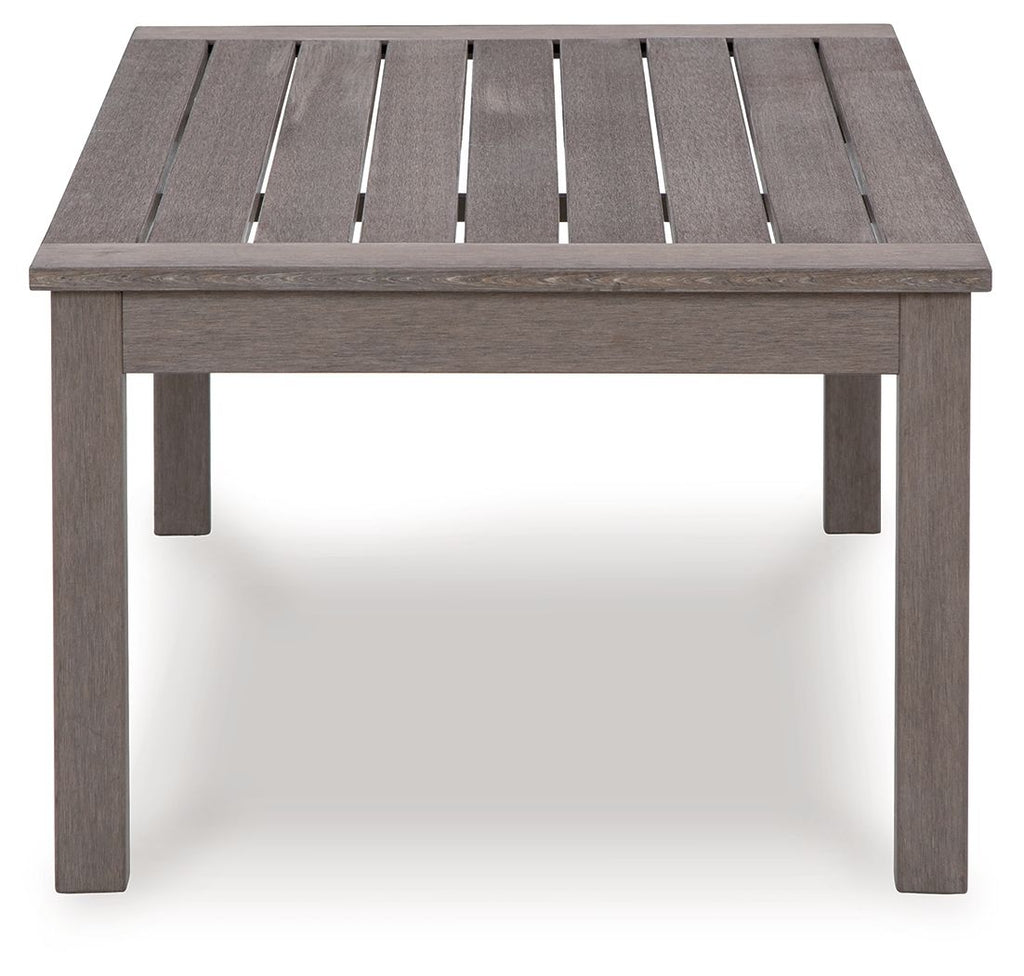 Rectangular cocktail table with brown slatted tabletop and open grooves