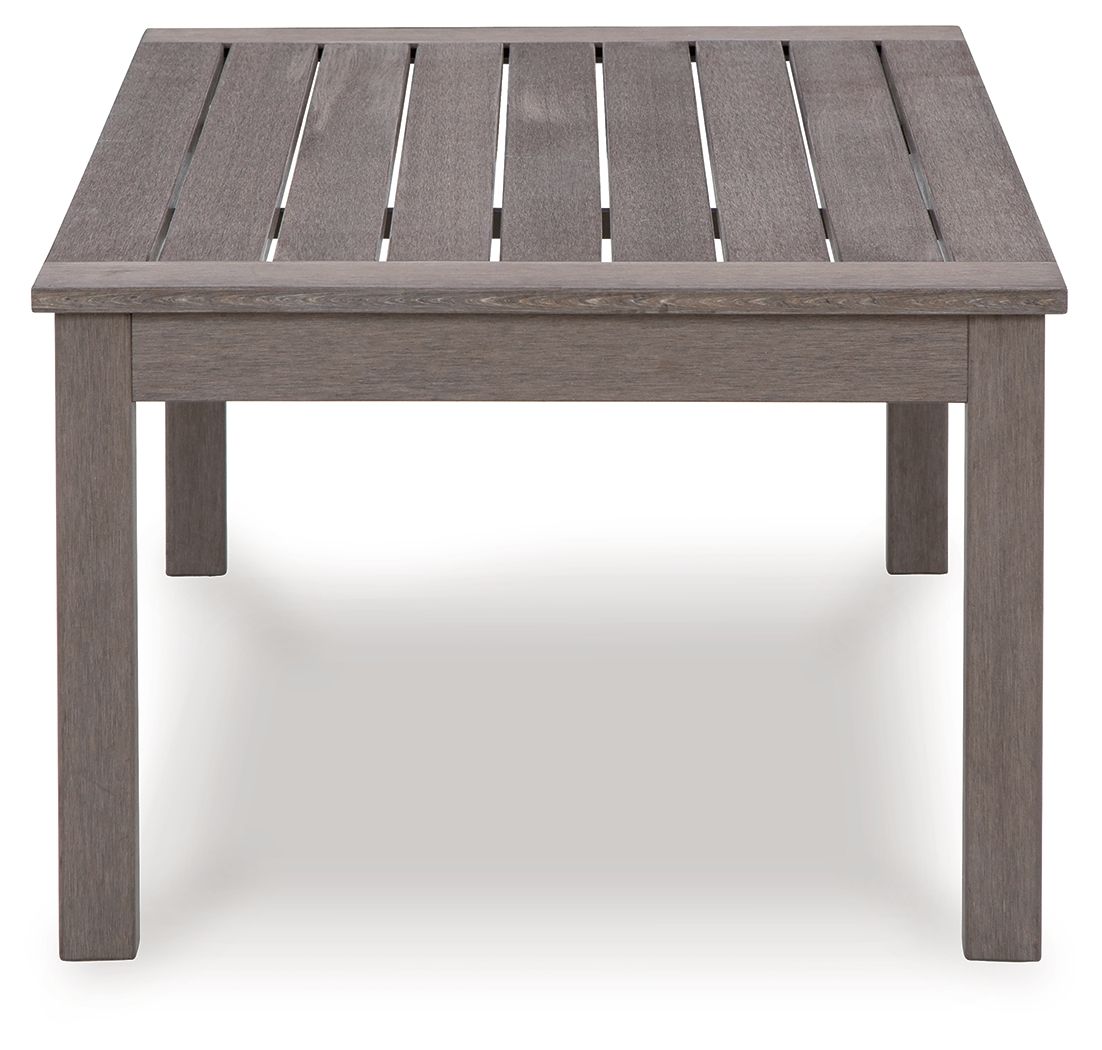 Rectangular cocktail table with brown slatted tabletop and open grooves