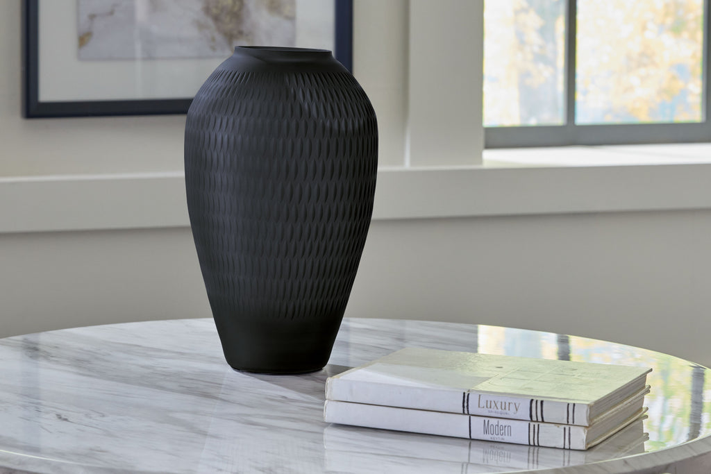 Etney vase, dark gray textured ceramic, tapered body with narrow opening on tabletop