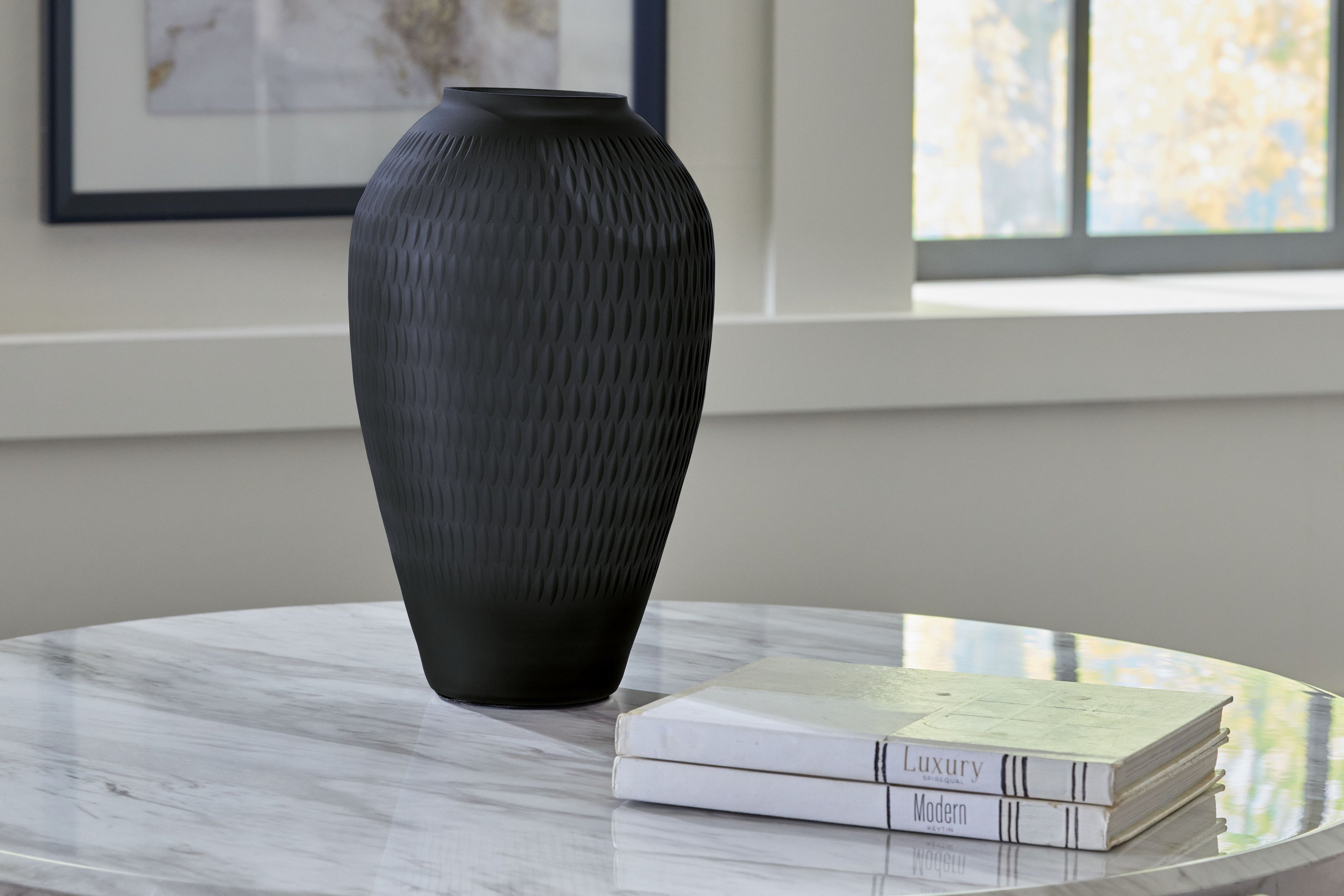 Etney vase, dark gray textured ceramic, tapered body with narrow opening on tabletop