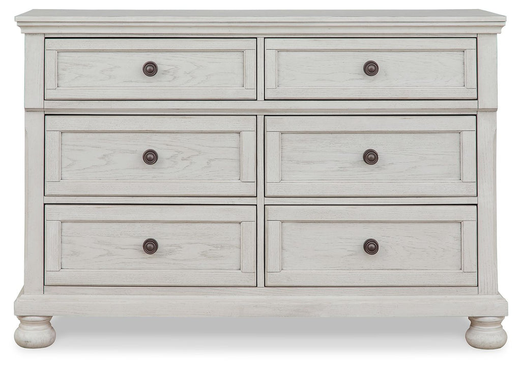 Antique white dresser with six drawers and round knob pulls, layered drawer layout.