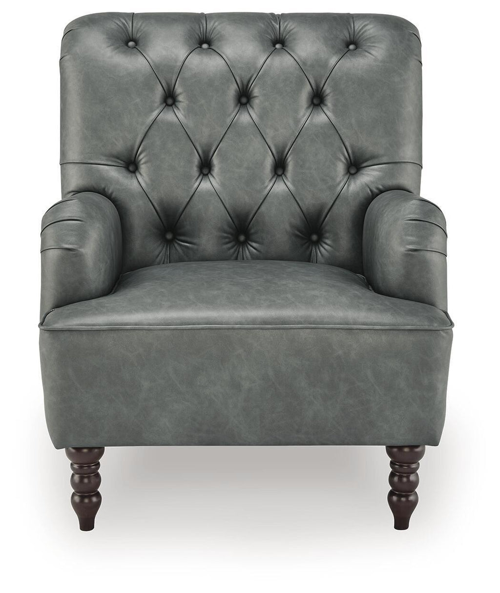 Dark gray velvet-look accent chair with tufted diamond back, winged arms, and wooden legs.