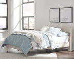 Beige panel platform bed with slatted headboard and footboard, shown with upholstered bedding