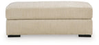 Lofwood Ottoman in textured beige fabric with low profile, square top, black feet