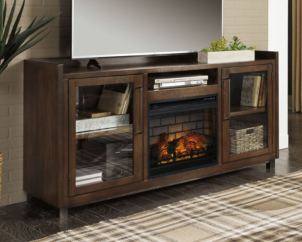 Dark brown TV stand with glass-front electric fireplace and media storage behind cabinet doors