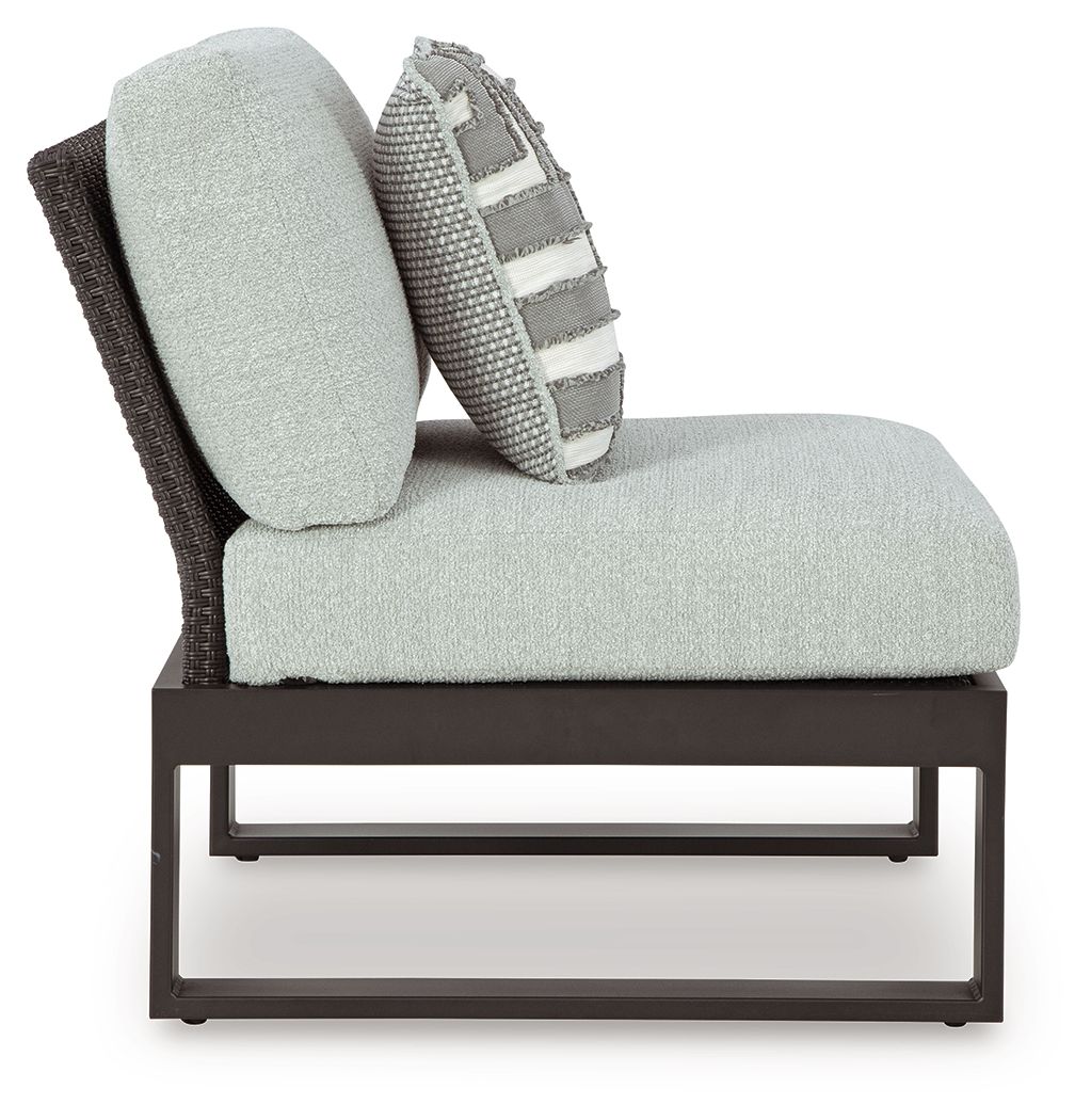 Outdoor sectional chair with chaise-style seat, light gray upholstery, black legs and frame