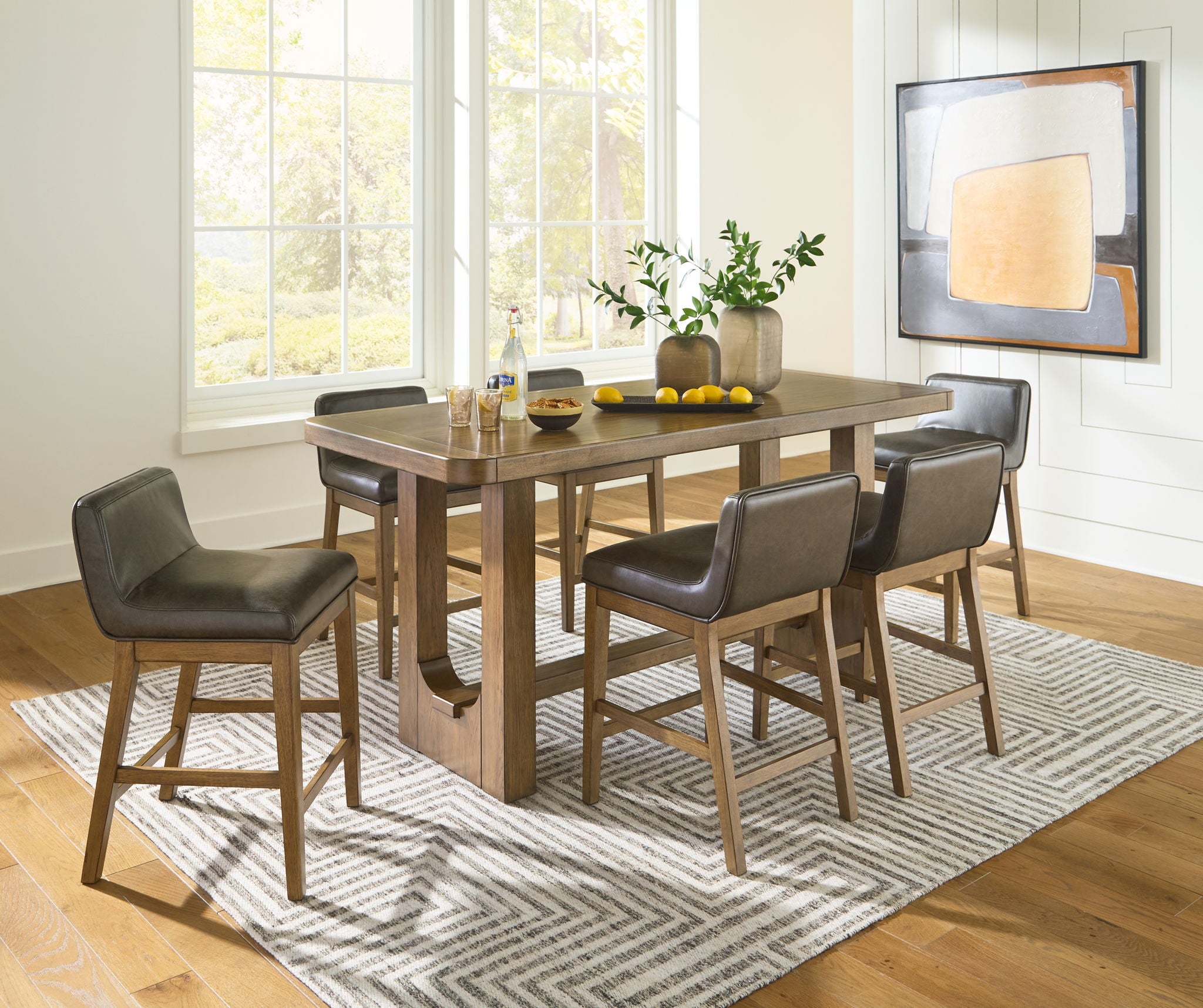 Dining table set with light brown rectangular counter table and four dark gray chairs