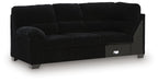Black LAF sofa with corner wedge, tufted back cushions and track arms
