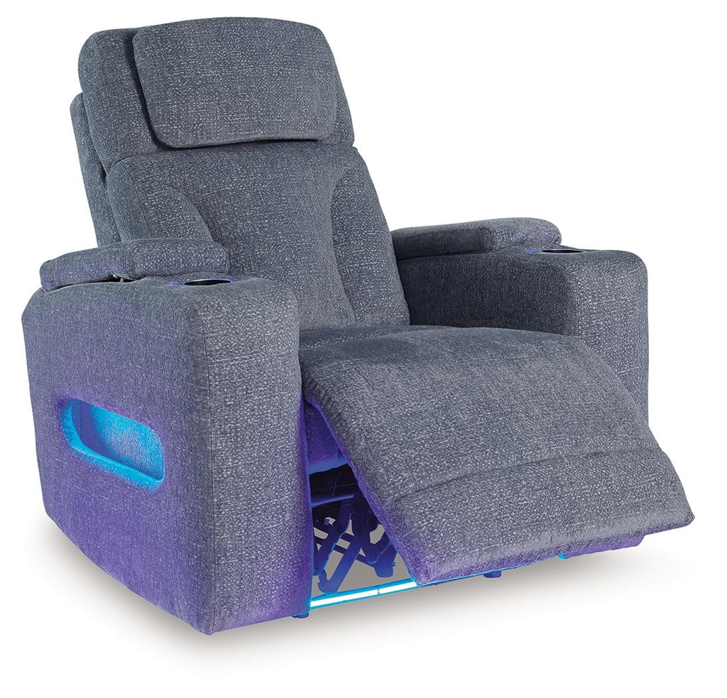 Dark gray fabric power recliner shown reclined, with blue light strip under footrest