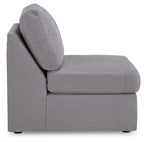 Gray armless chair with angled backrest and padded seat cushion, on short legs