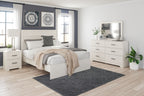 White dresser with mirror, featuring multiple drawers and black bar handles