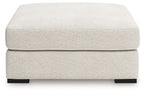 Vanilla upholstered accent ottoman with padded top, black block feet