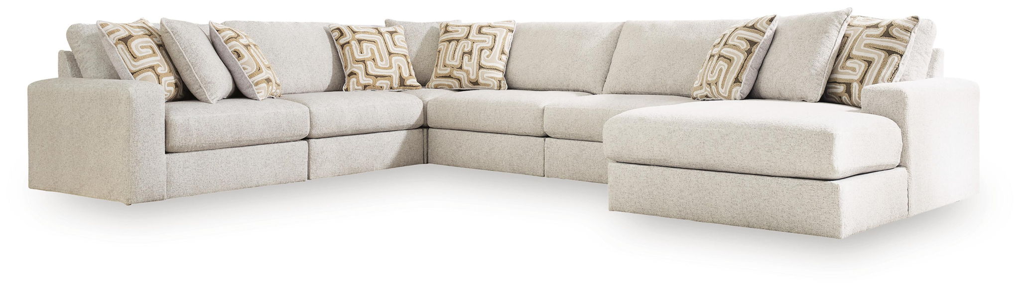 Light beige sectional sofa with corner layout and chaise-style ottoman end seat.