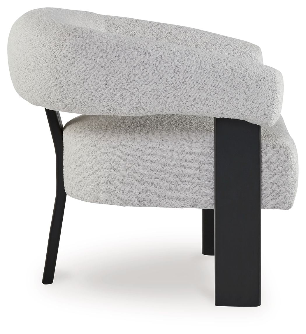 Gray upholstered accent chair with curved back, rounded arms, and dark legs